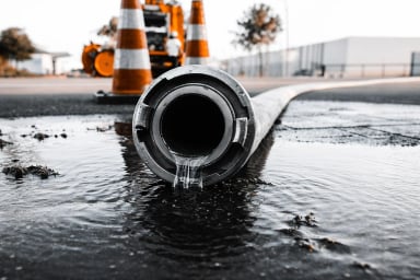 Water flowing from a Hose on a Construction Site