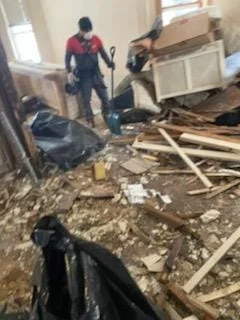 The CleanUP Guys crew clearing debris during a Chicago restoration job