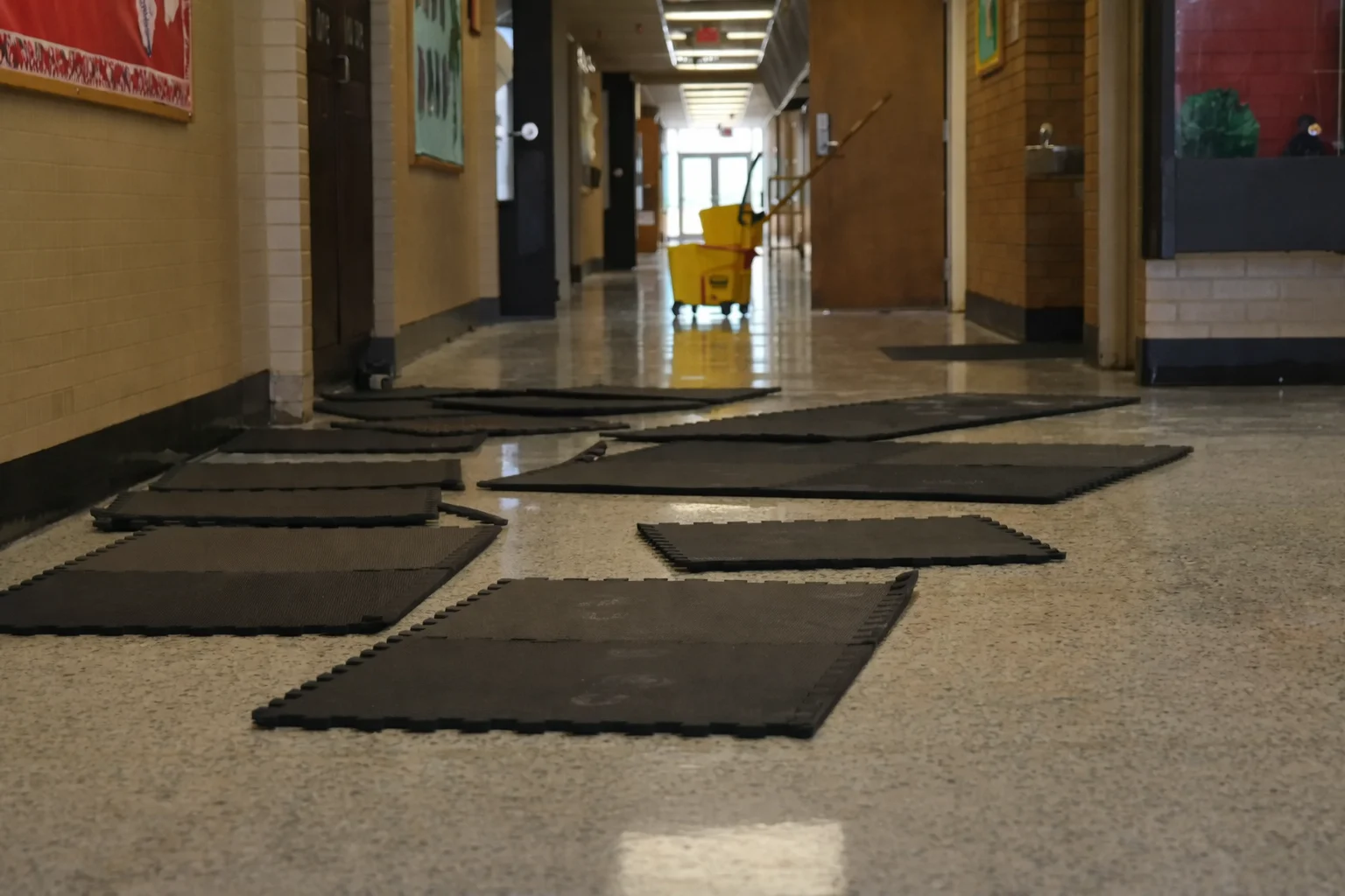 The CleanUP Guys drying a commercial school hallway floor after water damage in Chicago