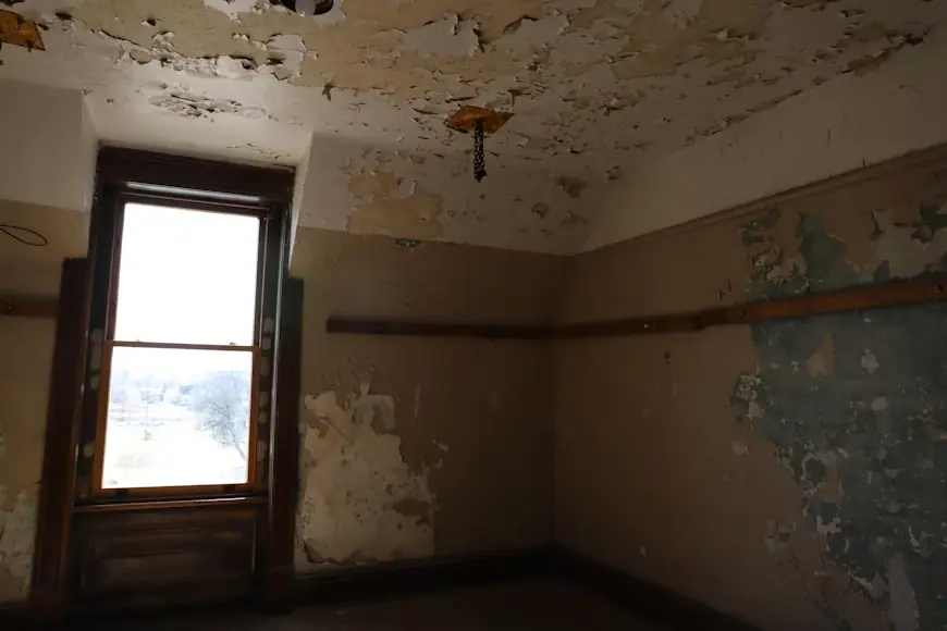 Water-damaged ceiling with peeling paint in a Chicago home