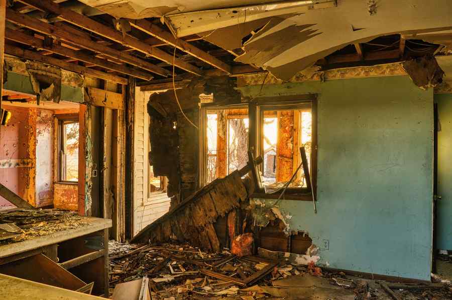 Fire-damaged home interior with charred walls and debris in Chicago