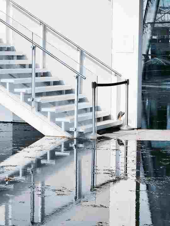 Water flooding a basement staircase in a Chicago home