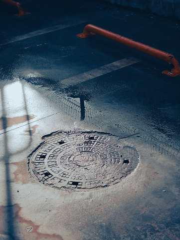 Standing water over a floor drain before sewage cleanup in Chicago